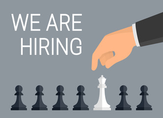 &#39;We are hiring employees&#39; concept. Vector Illustration of human hand over row of chess pieces - pawns and one queen. Flat design style