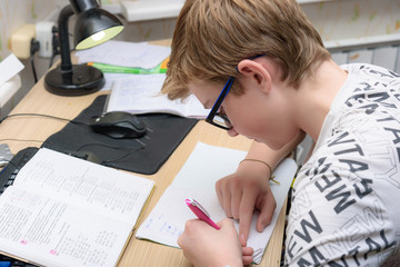 A nice schoolboy solved the problem. The student does homework.
