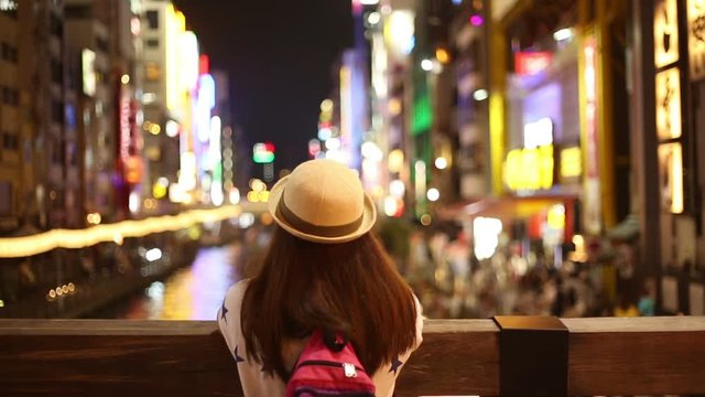 Girl in city at night