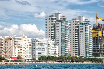 Fototapeta na wymiar Limassol downtown and apartment buildings at waterfront. Cyprus