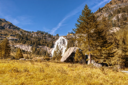 The waterfall of the river in the mountains