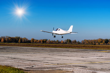 small plane flying over the ground