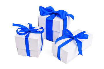 three blue ribbon gift boxes
