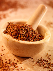 ALFALFA SEEDS IN PESTLE AND MORTAR
