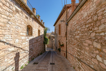 Narrow medieval street in Spello. Umbria, Italy