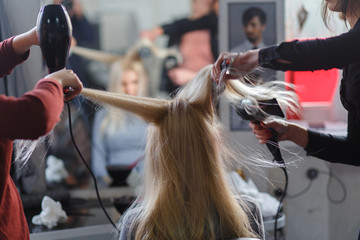 Two masters at the same time dried with hair dryers hair