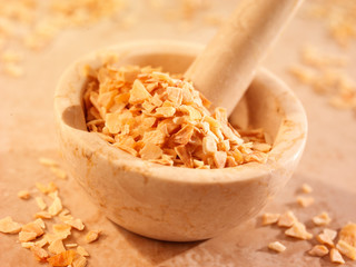 CHOPPED GARLIC IN PESTLE AND MORTAR