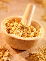 FENUGREEK POWDER IN PESTLE AND MORTAR