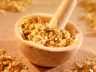 FENUGREEK POWDER IN PESTLE AND MORTAR
