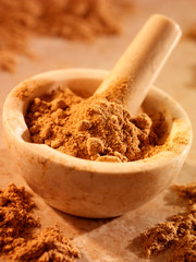 GINGER POWDER IN PESTLE AND MORTAR