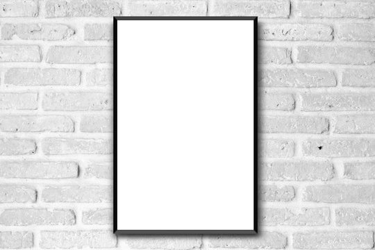 blank white poster with black frame on clean brick wall background for interior design concept 