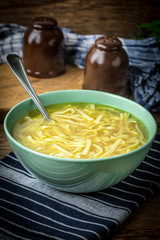 Broth - chicken soup in a bowl.