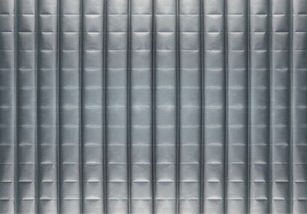 Abstract silver background with horizontal and vertical lines, lit with a soft light.