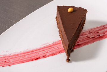 Chocolate mousse, a large piece of chocolate cake on a plate