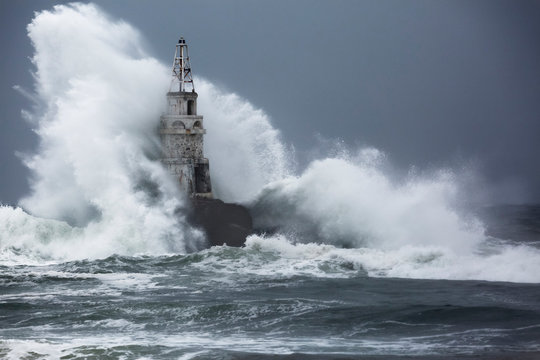 Big storm near an old lighthouse in Achtopol bay, Black sea, Bulgaria