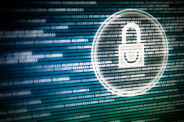 cyber security. white light padlock icon on led computer screen monitor display. blue and green...