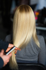 Stylist demonstrate female blonde hair