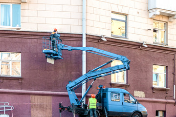 workers repair the light in the city.