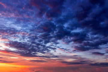 Naklejka na ściany i meble Sunset dramatic sky clouds. Sky with clouds and sun.