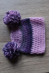 Crochet baby hat with large Pom poms