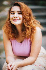 Fototapeta premium Fashion portrait of pretty young woman posing ouside, plus size model