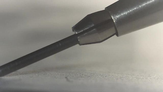 Iron pencil shows graffit on a paper close up