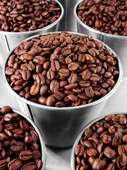CONTAINERS FULL OF COFFEE BEANS