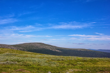 Beautiful view for postcards. Beautiful mountainscape scenery and blue sky. Mountains and plains of the Northern Urals.