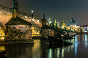 View of the Charles Bridge and Vltava river in Prague in a cold winter night - 4