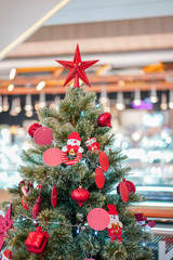 The big red star decoration topped of the Christmas's tree.