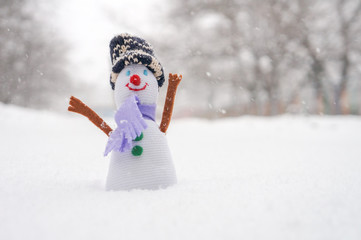 Funny snowman waving with hand