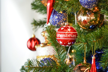 Christmas tree (white and green colour) and new year decoration in the department store.