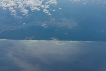 Blue sky high view from airplane clouds