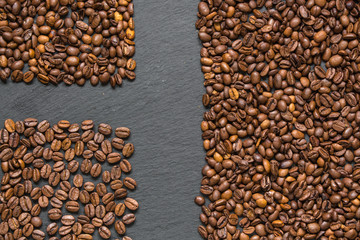 coffee grain (good and bad grain) - Arabica and Robusta blend (roasted coffee grain). Black background. Top view . Copy space.