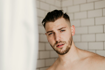 Young Male Model Washing Hair in Trendy Subway Tile Wet Shower 