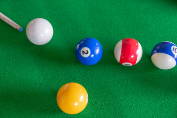 American Billiard balls on the green table.