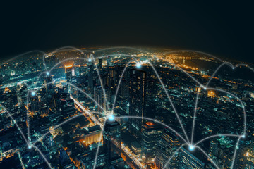 Network and Connection technology night city background at business center bangkok thailand. Wireless skyline connection with energy light infographic.