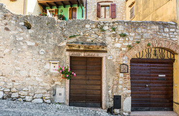 Fototapeta na wymiar ancient walls in the little medieval village of Malcesine. It is one of the most characteristic towns of Lake Garda in Verona Province, italy
