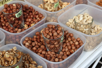 Bowl with nuts on a wooden table