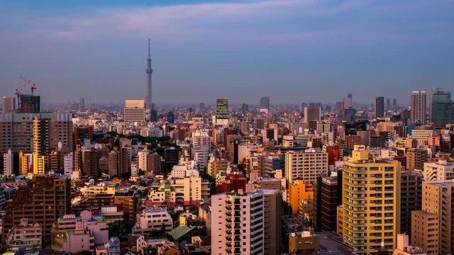 Tokyo, Japan. Skyline in the evening. Cloudy sky over urban area in Bunkyo, Tokyo, Japan. Time-lapse at sunset