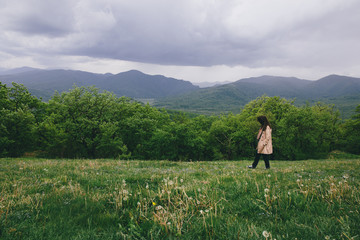 Woman walking on meadow