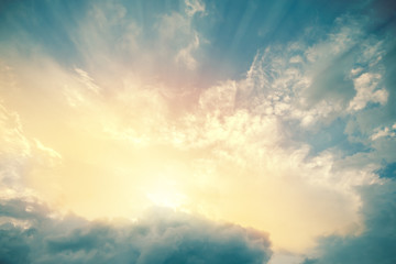 Heavenly view of sun beams lighting turquoise blue sky. For background and wallpaper