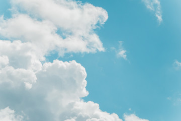 White fluffy clouds in turquoise blue sky. Copy space. For background and wallpaper