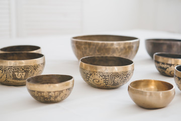 Tibetan singing bowls on white background in Spa