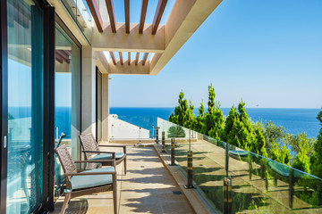 Terrace of a spacious luxury villa with a picturesque sea view