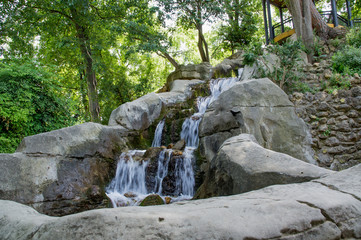 Fototapeta na wymiar Natural waterfall Maria Luisa Park in the Andalusian capital, Sevilla in Spain