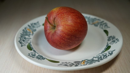 red apple on a plate