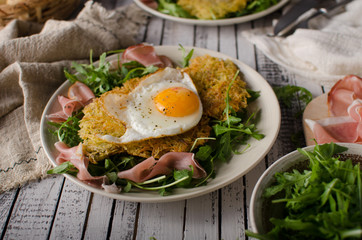 Potato pancakes with eggs and ham