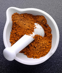 CURRY POWDER IN PESTLE AND MORTAR