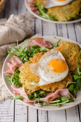 Potato pancakes with eggs and ham